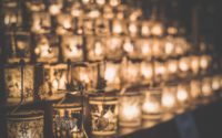 clear glass candle holder on brown wooden table
