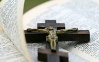 crucifix on top of bible