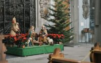 statues near the christmas tree