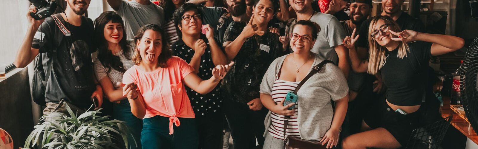 positive diverse people making faces at camera