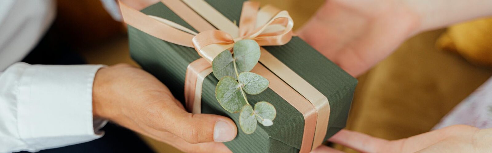 person giving a gift box