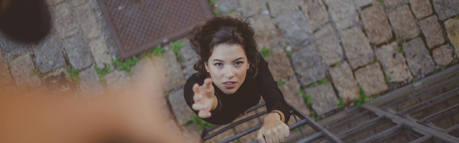 high angle photo of woman on ladder