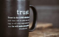 black mug with proverb from holy bible