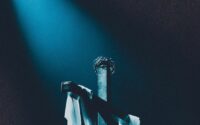 white fabric on a wooden cross