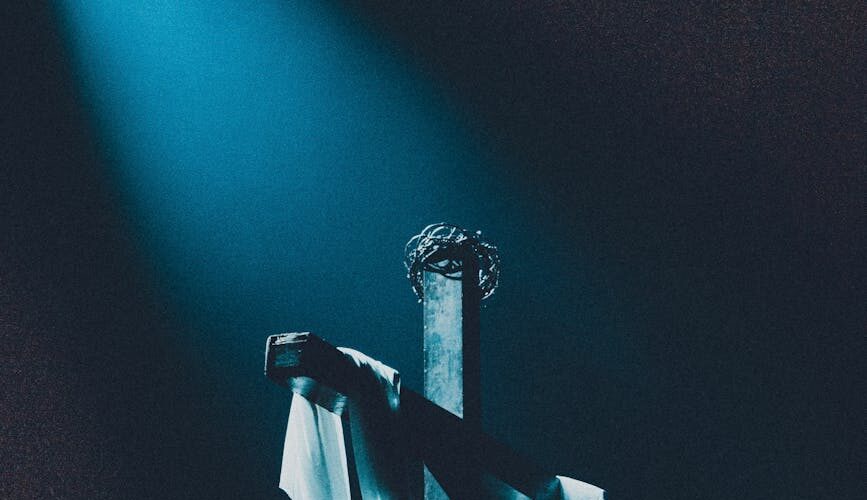 white fabric on a wooden cross